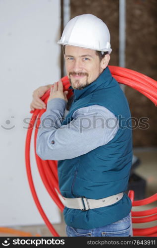 a happy man with pipes