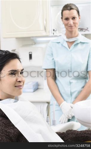 A happy patient and a friendly dentist in the dentist&acute;s office.