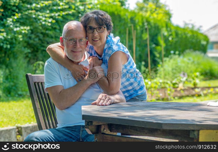 a happy senior couple in the garden