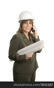 A happy, smiling female architect holding blueprints and talking on her cellphone. Isolated.