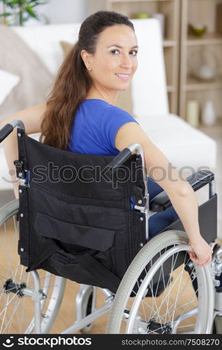 a happy woman in a wheelchair