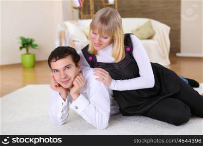 a happy young couple in love at home together