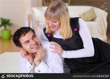 a happy young couple in love at home together