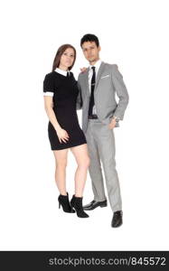 A happy young couple in suit and dress standing smiling isolated for white background in the studio