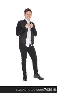 A happy young teen boy standing smiling is a black jacket and pants with black dress shoos, isolated for white background