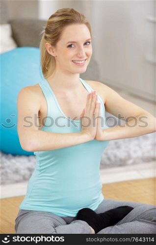 a happy young woman during yoga exercising