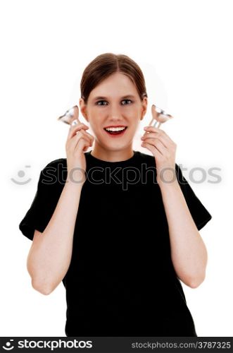 A happy young woman holding up two light bulbs, having a great idea,isolated on white background.