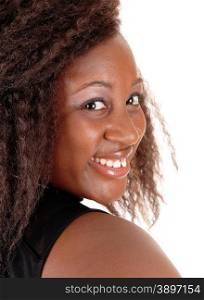 A head shoot of a young African American woman in a black dress, with frizzy hair, isolated on white background.
