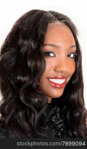 A head shot of a beautiful African American woman with long blackcurly hair, smiling isolated for white background.