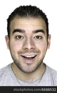 A headshot of a young man that is amazed or thrilled about something.