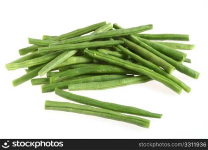 A heap of tender green haricot beans over a white background