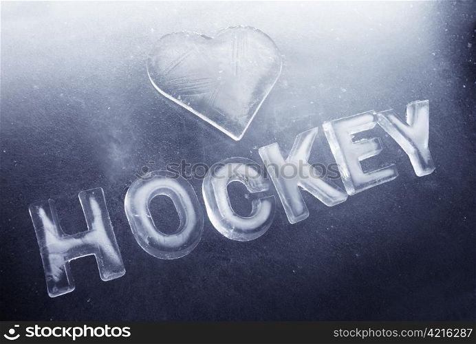 "A Heart shape and word "hockey" made of real ice."