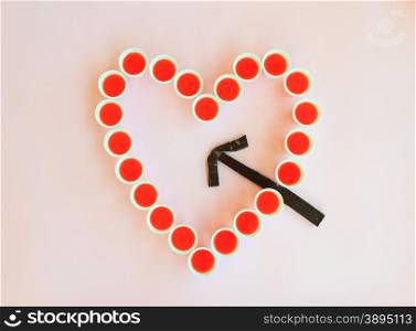 a heart-shaped glasses is hit by an arrow of chocolate to remember valentines day