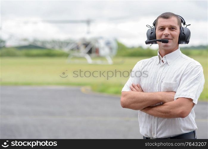 a helicopter pilot is outdoors
