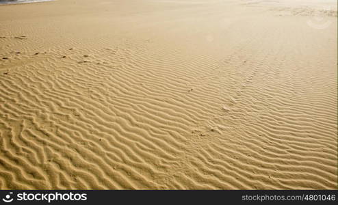 A high view of textured sea sand.