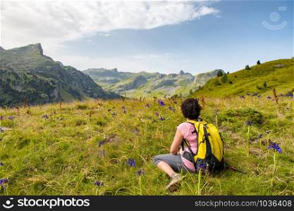 a hiker woman resting in the mountain