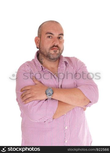 A Hispanic man standing in the studio with his arms crossed wearing a beard and almost bald, isolated for white background