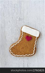 A Homemade Gingerbread Biscuit in the Shape of a Christmas Stocking