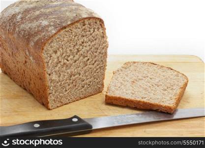 A homemade loaf of wholemeal bread with the end sliced off