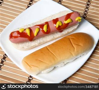 a hot dog in a white plate