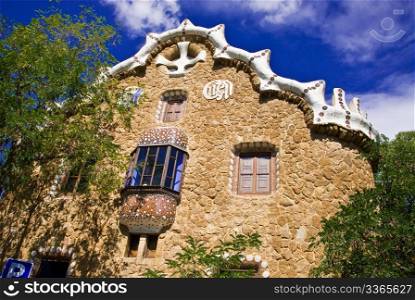a house with lot of tiles and details styled by antonio gaudi in park guell