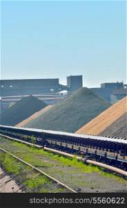 a huge coal loading conveyor belt piles coal