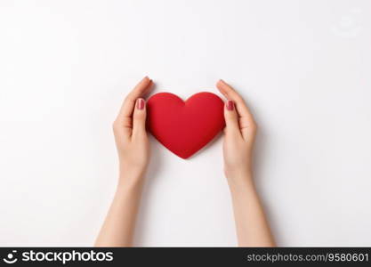 A human hand holding a heart isolated on a white background.