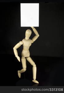 a humanoid doll with black background and white sign to write things