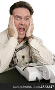 A humorous photo of a very shocked man doing his accounting. Isolated on white.