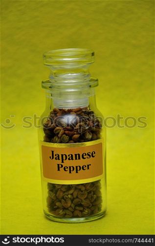 A jar filled with Japanese salt on a yellow background