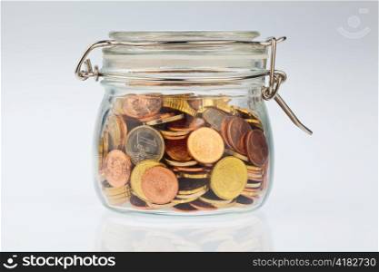 a jar of coins of the european currency euro. precautionary savings, and protection for the pension.