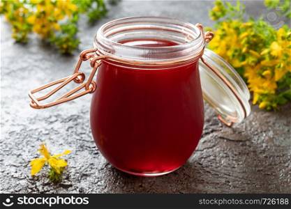 A jar of red oil made from St. John's wort flowers