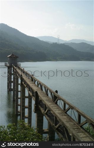 A jetty stretches out over a fresh water lake in China.
