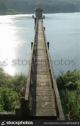 A jetty stretches out over a fresh water lake in China.