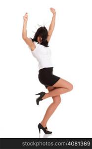 A joyous young female business executive celebrating success with raised hands on white