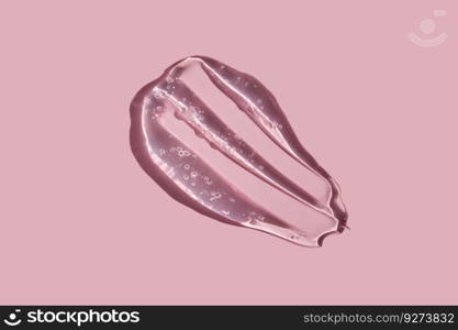 A juicy drop of gel on a pink background. A perfect illustration for women’s cosmetics.. Texture of cosmetic gel on a pink background.