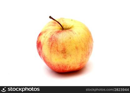 a juicy red and yellow apple on a white background