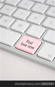 A keyboard with a find love now button