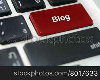 A keyboard with a red button blog