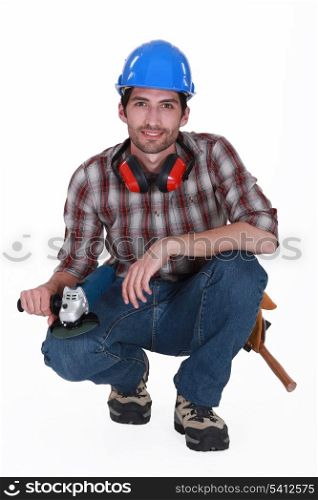 A kneeled handyman.
