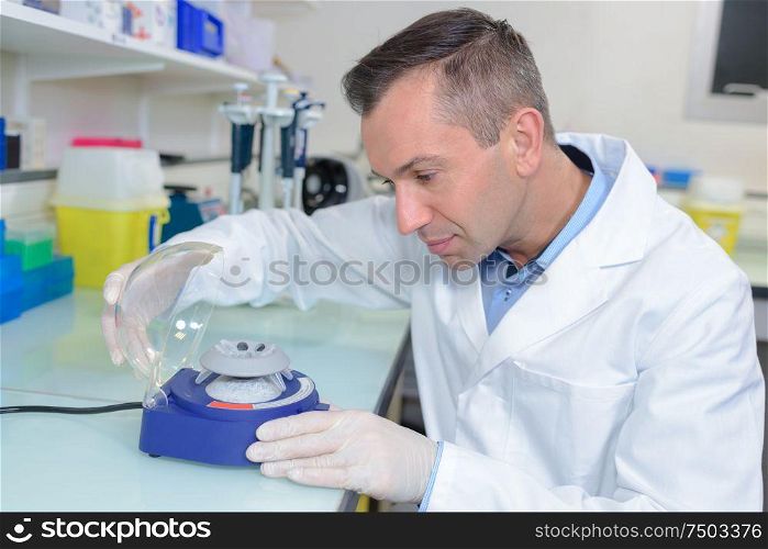 a lab technician using apparatus