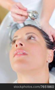 a lady having hair washed