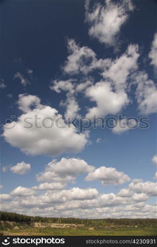 A landscape of land and cloudy sky