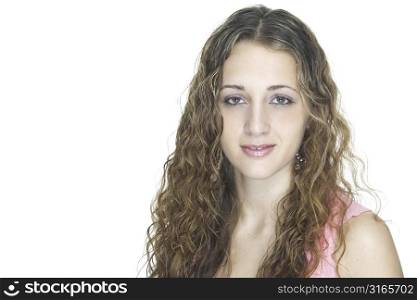 A landscape picture of a beautiful young female model with long curly hair