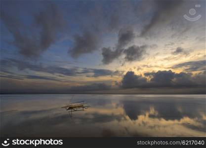 A landscape view of mirroring object in the sun-rise with beautiful colors