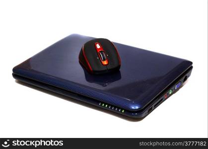 A laptop and a wireless mouse on a white background