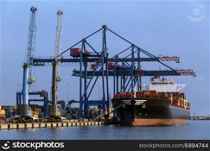 A large container ship unloading in the port of Klaipeda in Lithuania.
