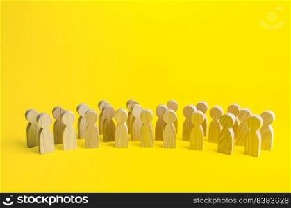 A large group of figurines of people on a yellow background. Social survey and public opinion, electorate. Population and citizens. Human resource, search for candidates. Personnel Management.