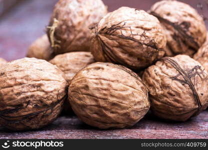 a large pile of fresh useful walnuts