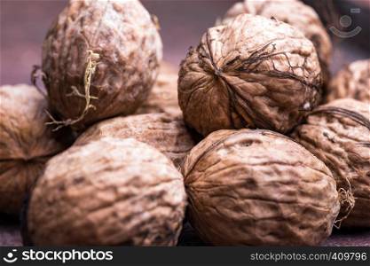 a large pile of fresh useful walnuts